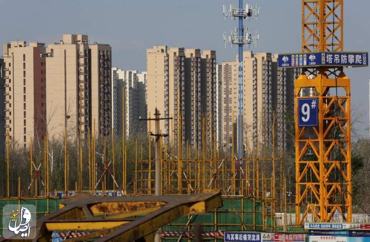 Residential buildings are pictured near a construction site in Beijing, China April 14, 2022.